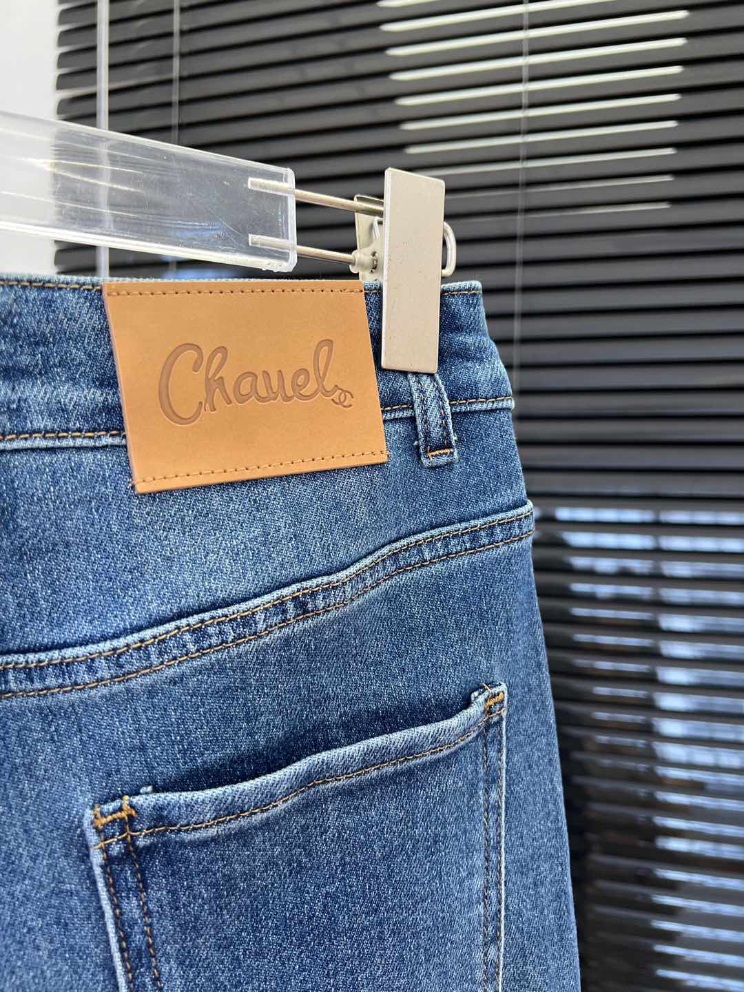 C 25 Laminated lettering stretch straight-leg trousers