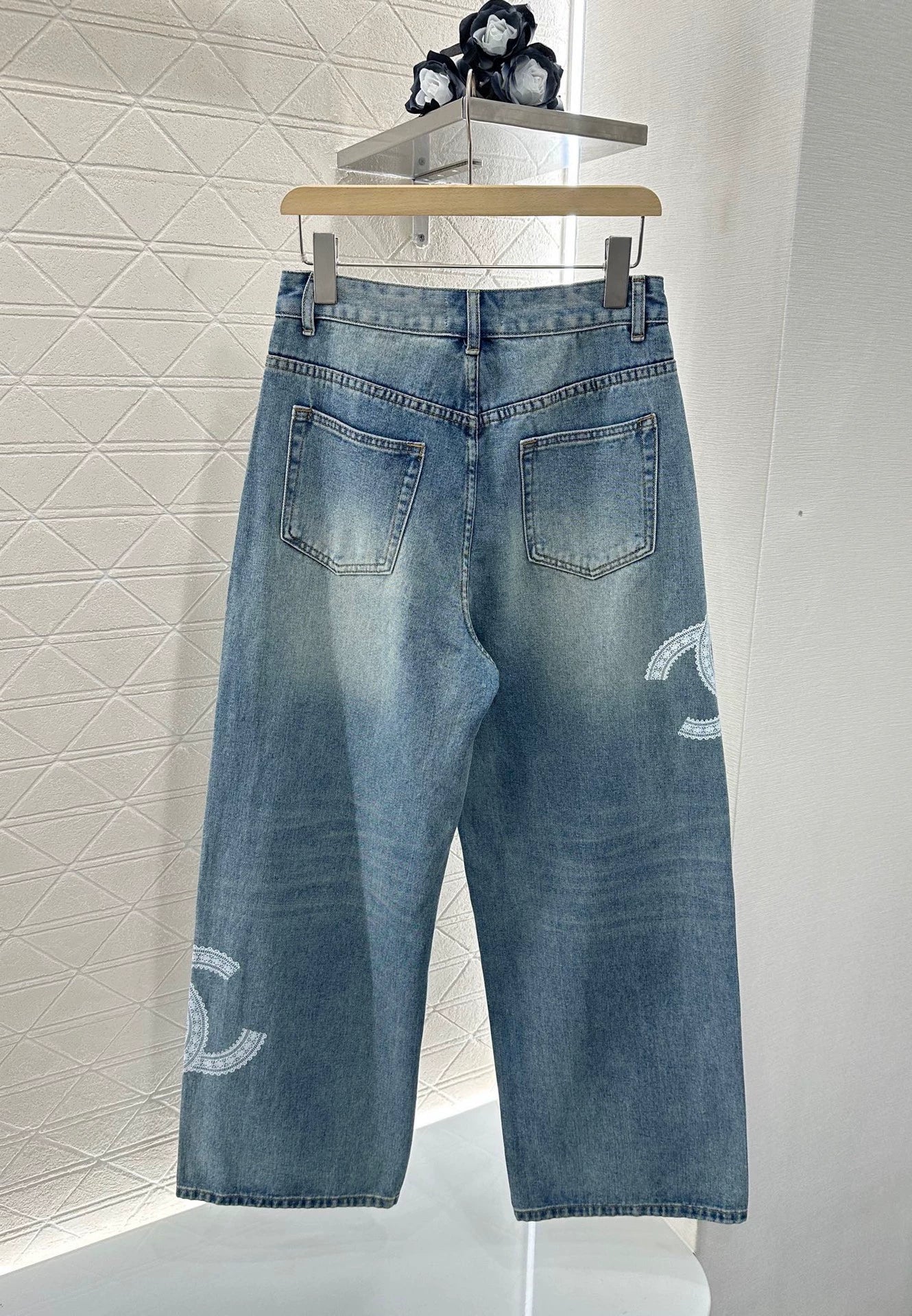 C 25 Lace-embroidered denim trousers