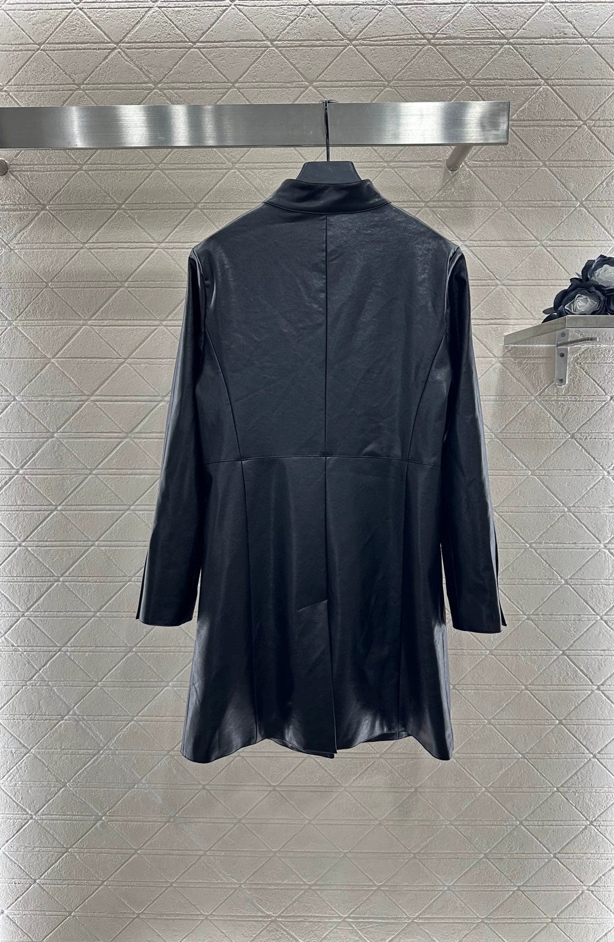C 25 Mid-length leather trench coat.