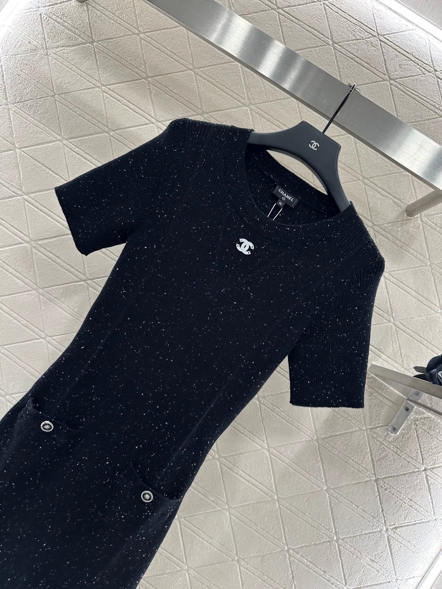 C 25 Simple black knitted short-sleeved dress.