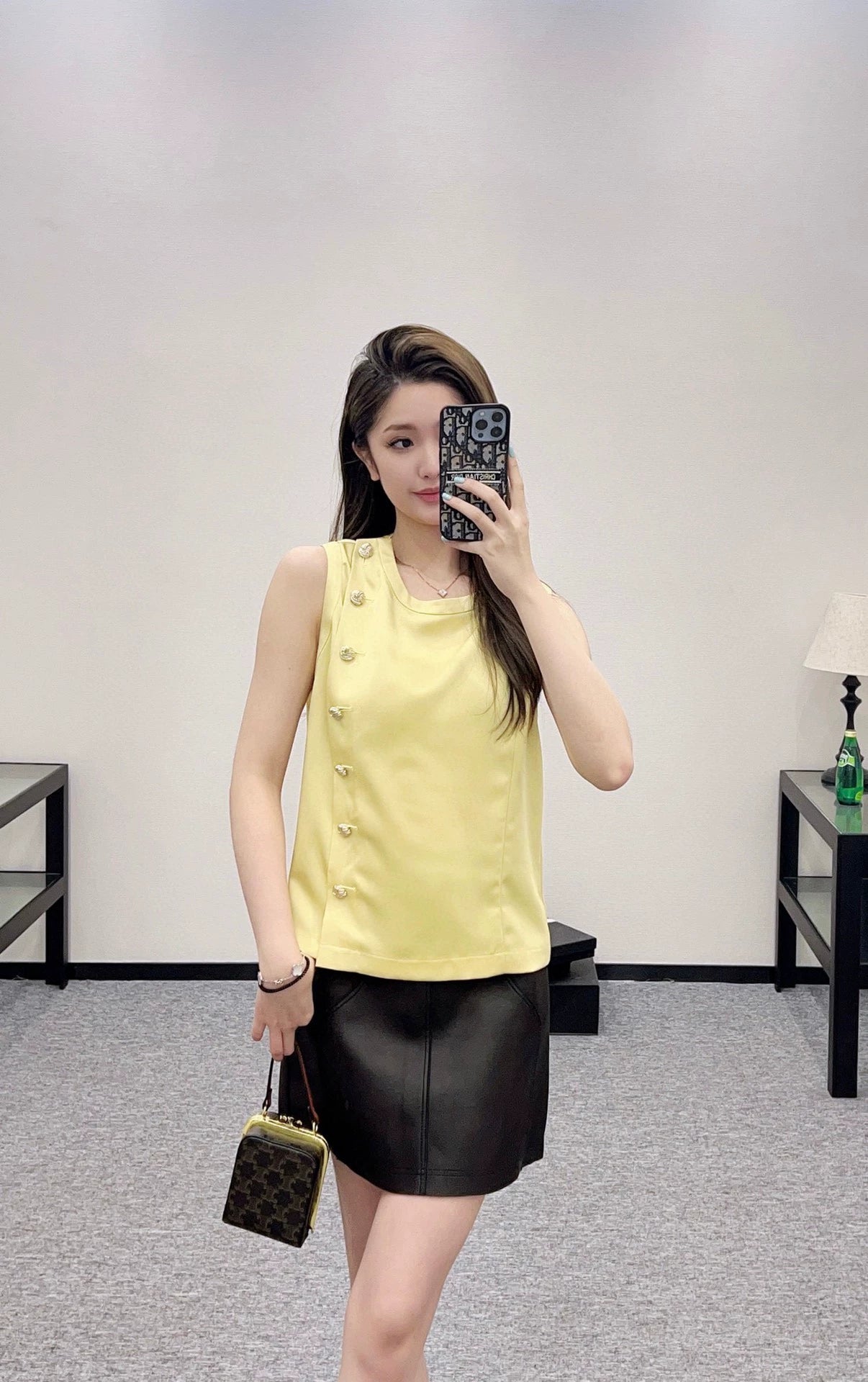 Sleeveless button-down top