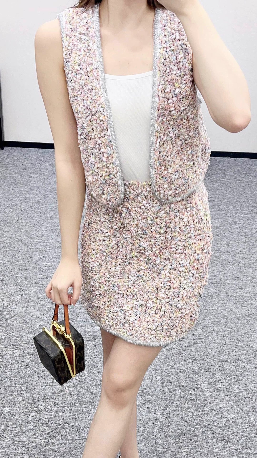 C 25 Knitted dress, vest, and skirt set.