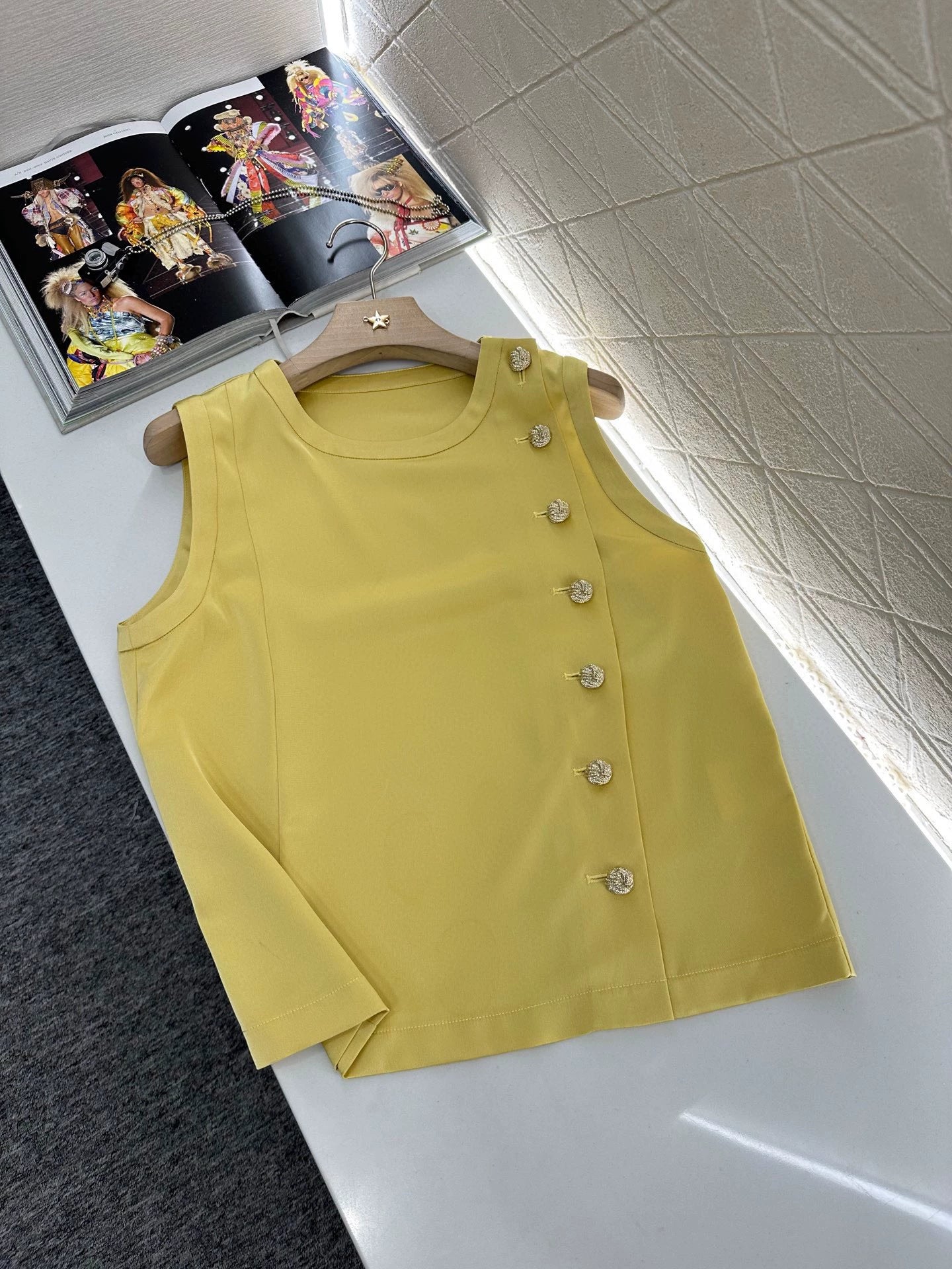 Sleeveless button-down top