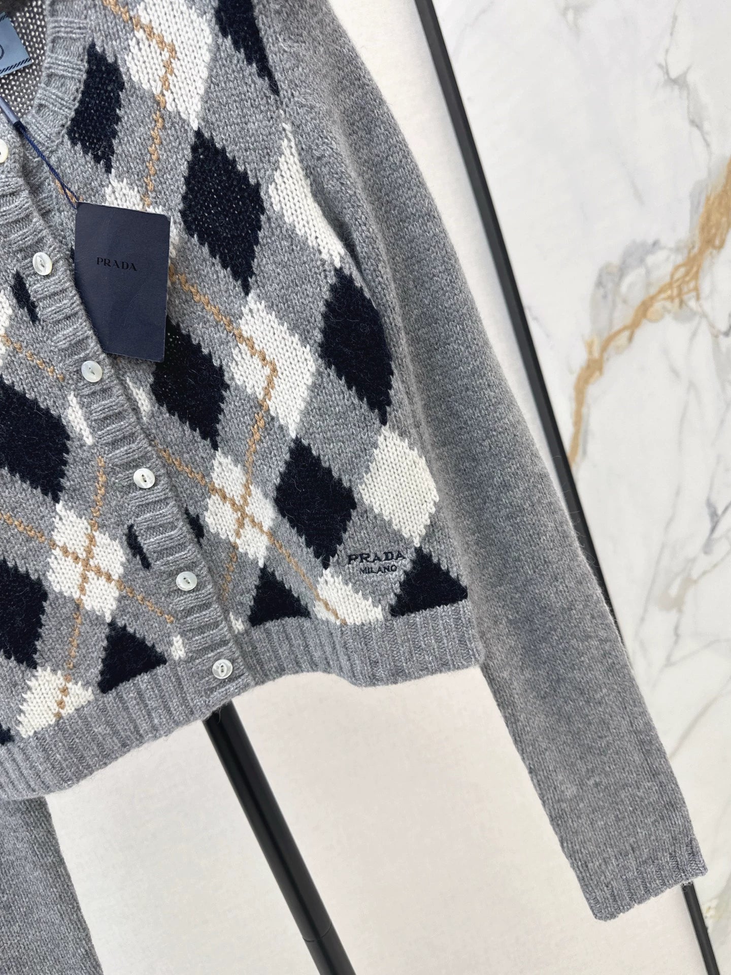 P 25 College style diamond patterned long sleeved cashmere cardigan