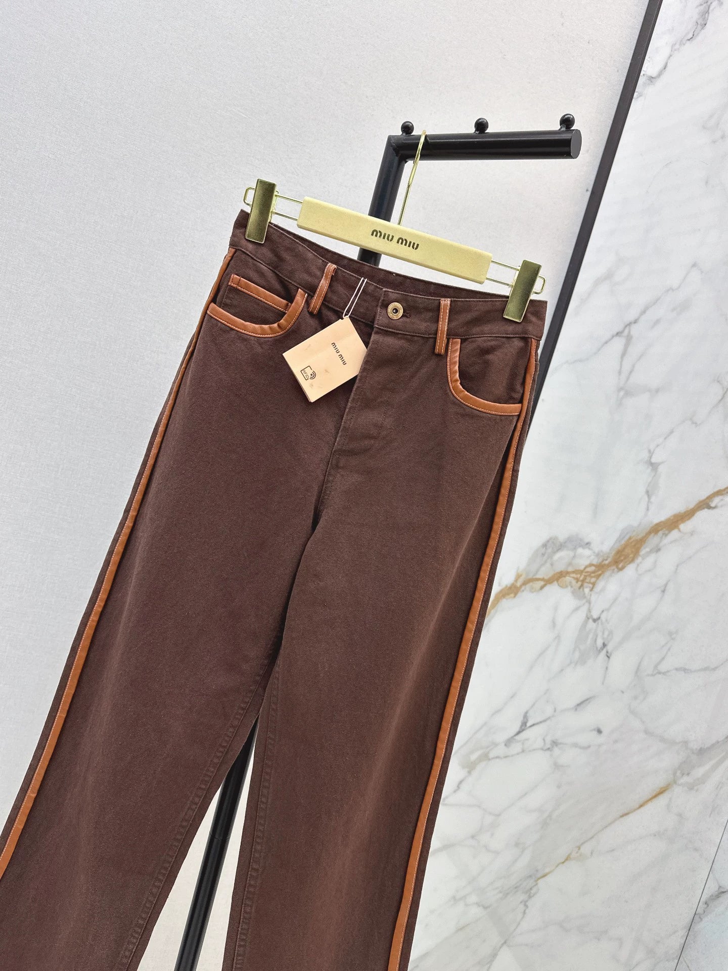 M 25 Brown jeans with leather detailing