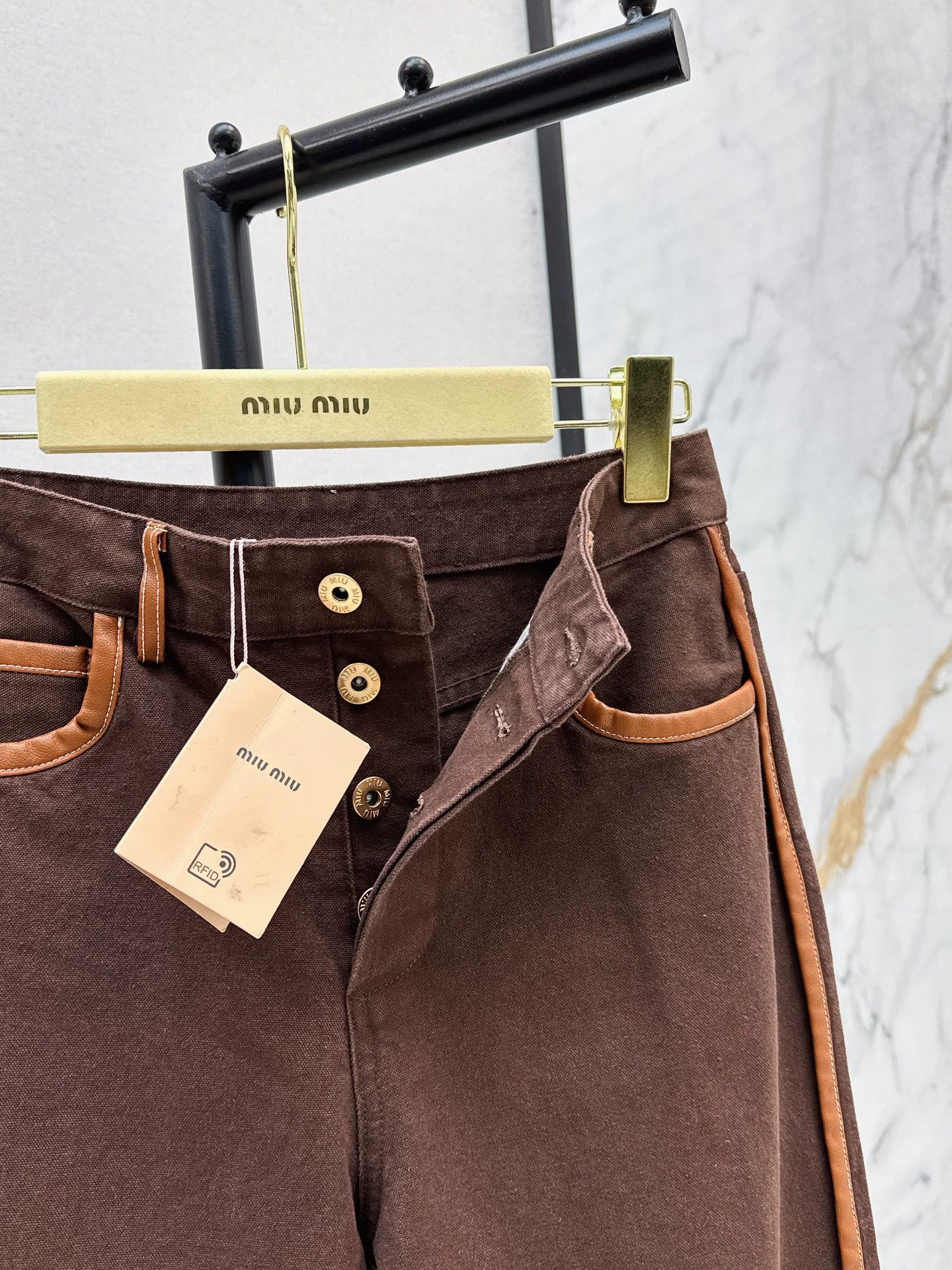 M 25 Brown jeans with leather detailing