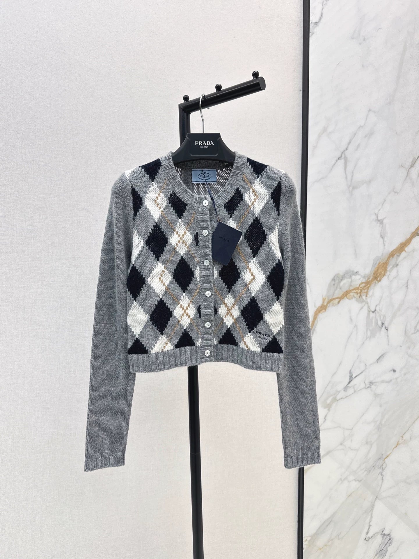 P 25 College style diamond patterned long sleeved cashmere cardigan
