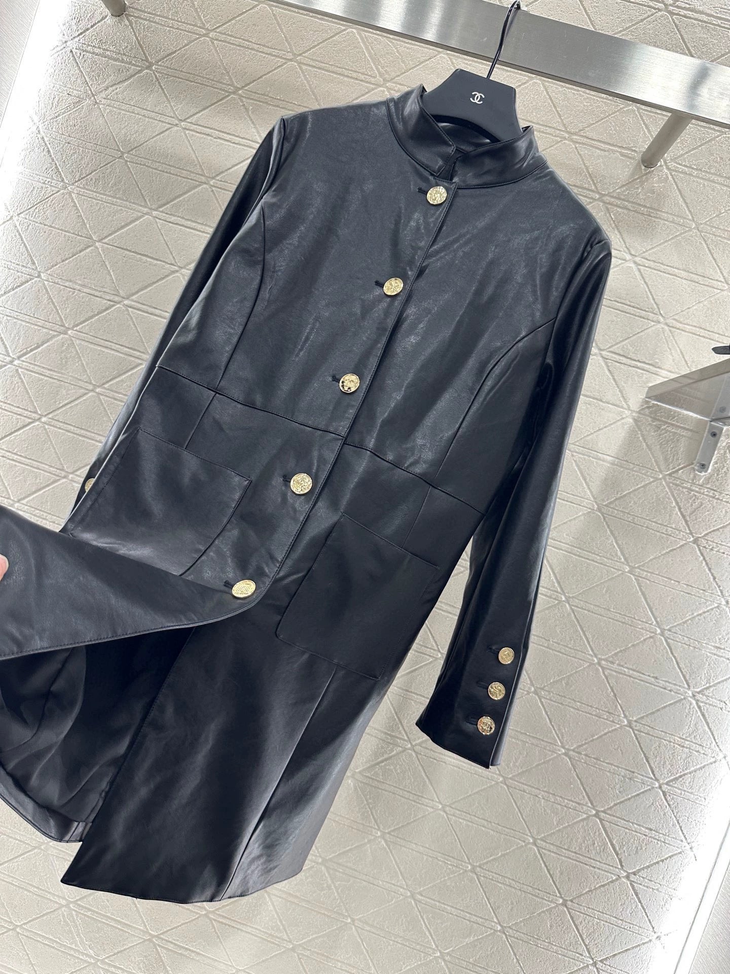 C 25 Mid-length leather trench coat.
