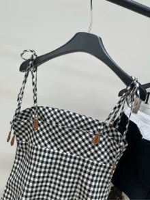 m 25 Summer new black and white checkered leather letter suspender skirt