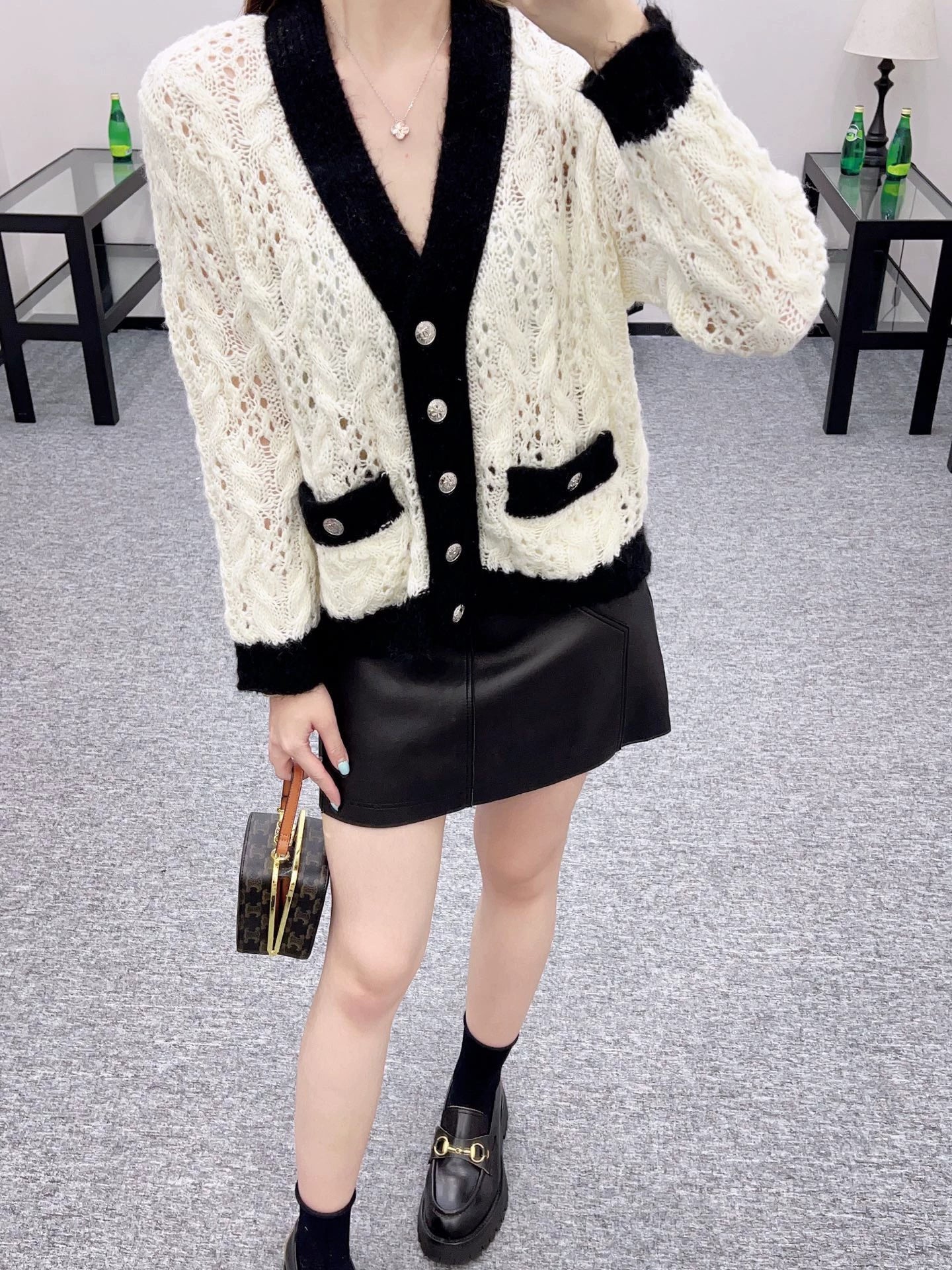 C 25 Contrast-color crochet cardigan.