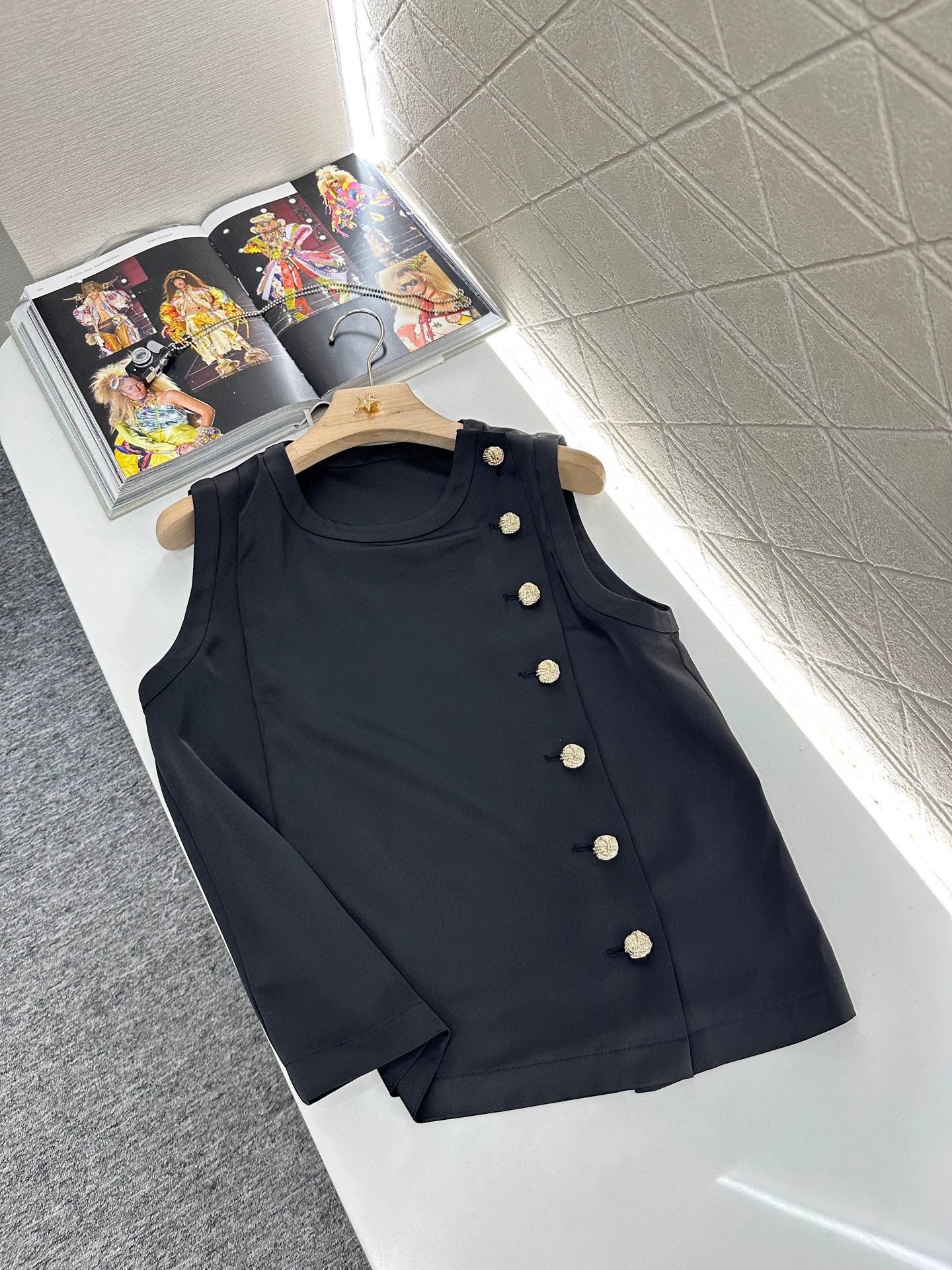 Sleeveless button-down top