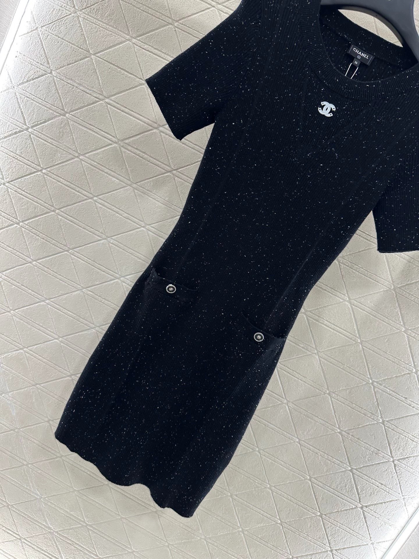 C 25 Simple black knitted short-sleeved dress.