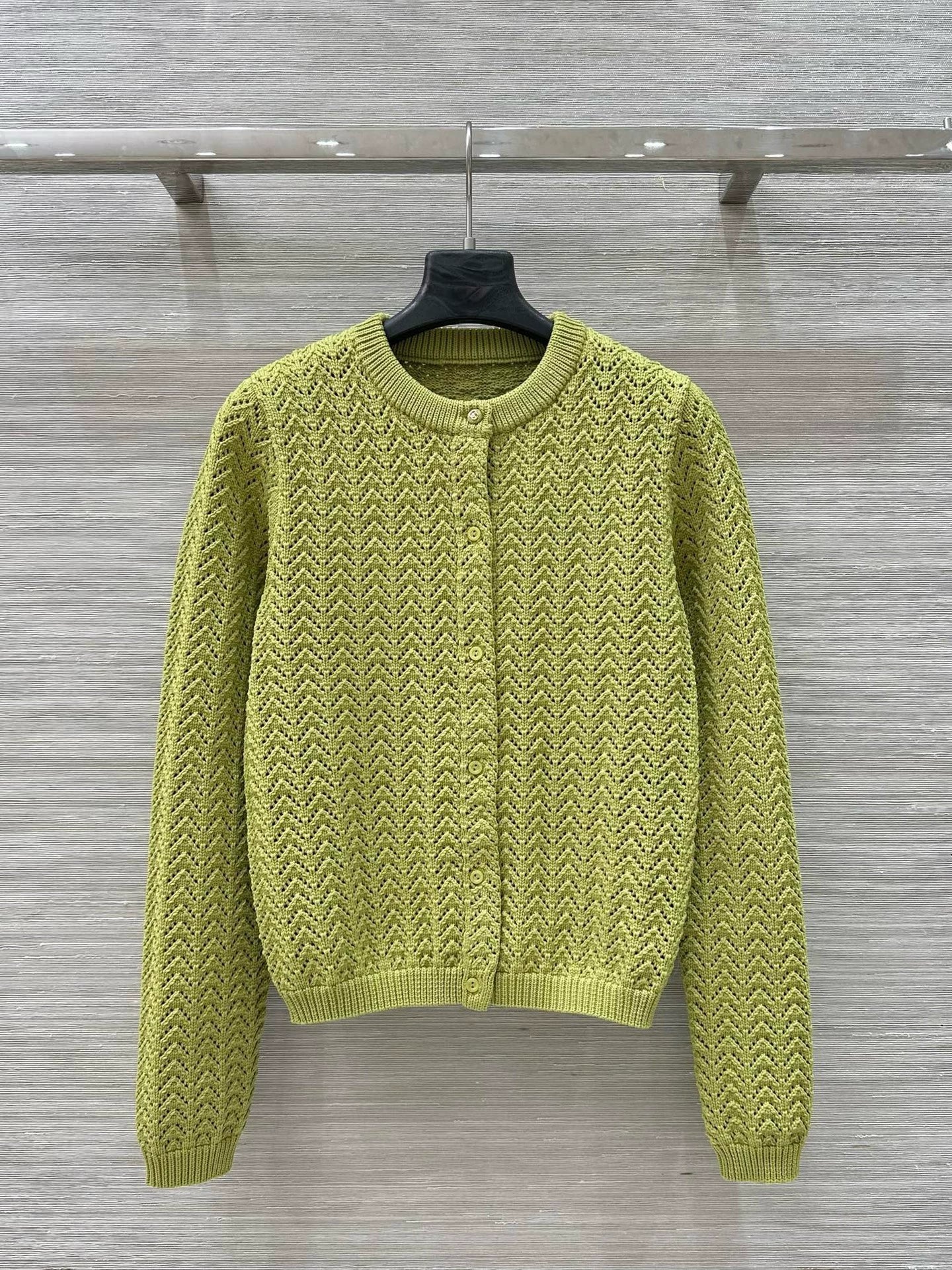 G 25 New Knitted cardigan with cut-out design.