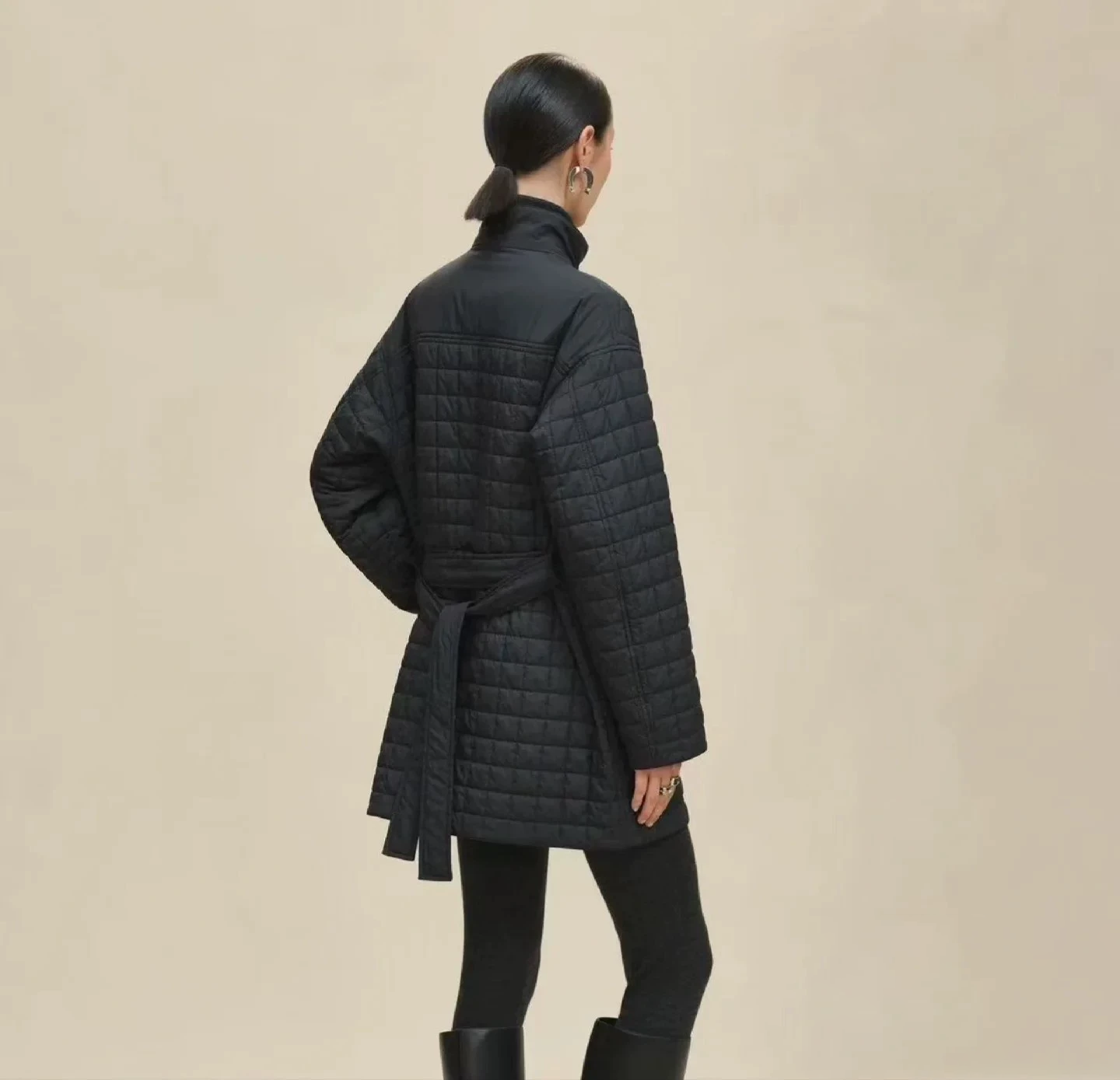 H 25 Stand-up collar, zippered mid-length padded jacket.