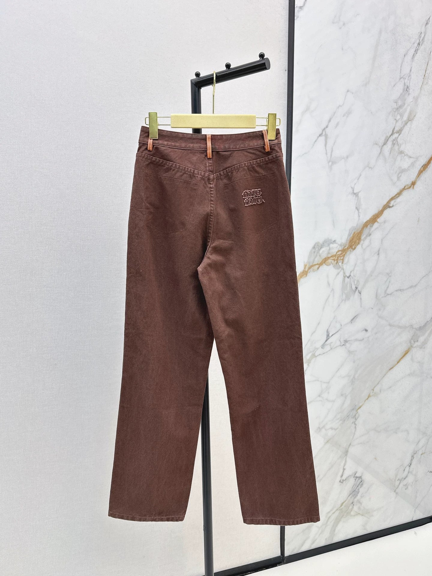 M 25 Brown jeans with leather detailing