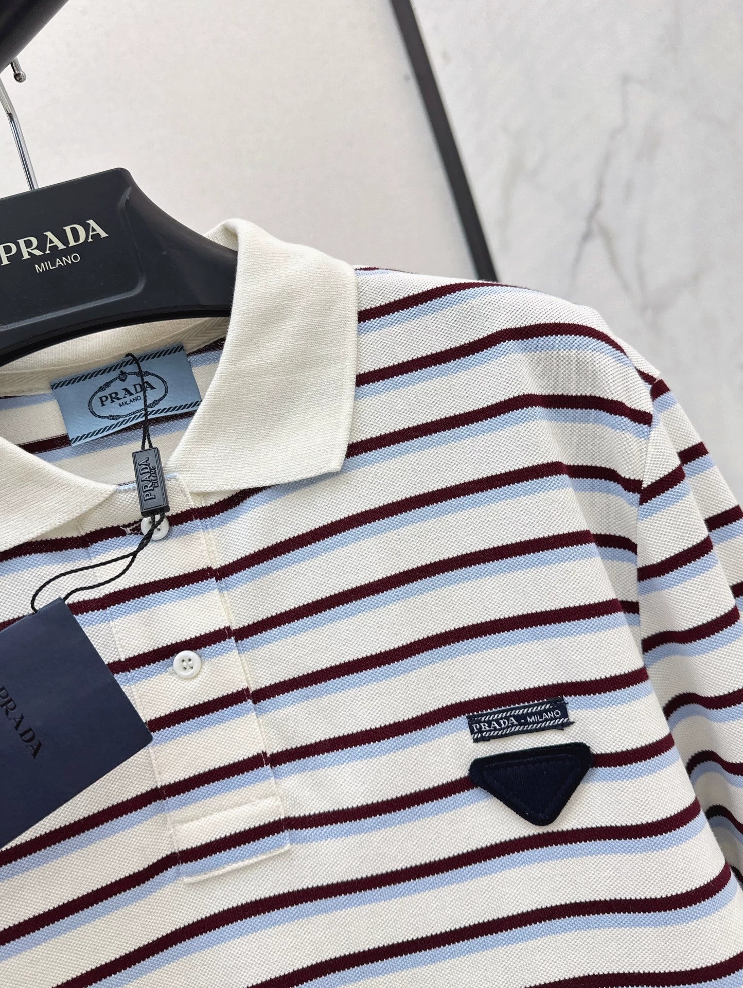 P 25 New Striped long-sleeve polo shirt