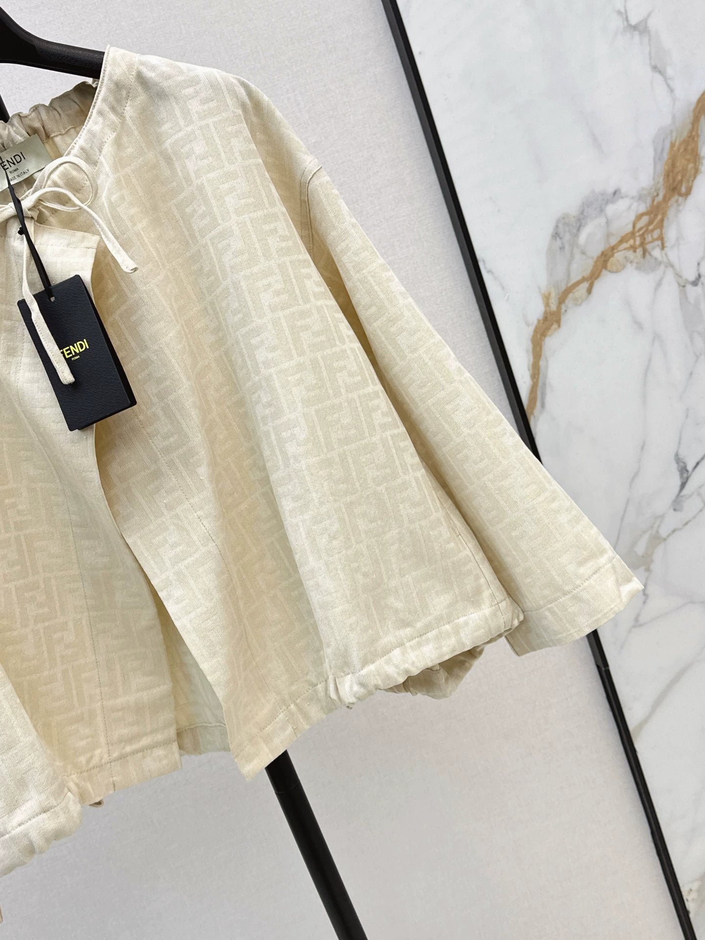 Fe 25 letter print cape coat