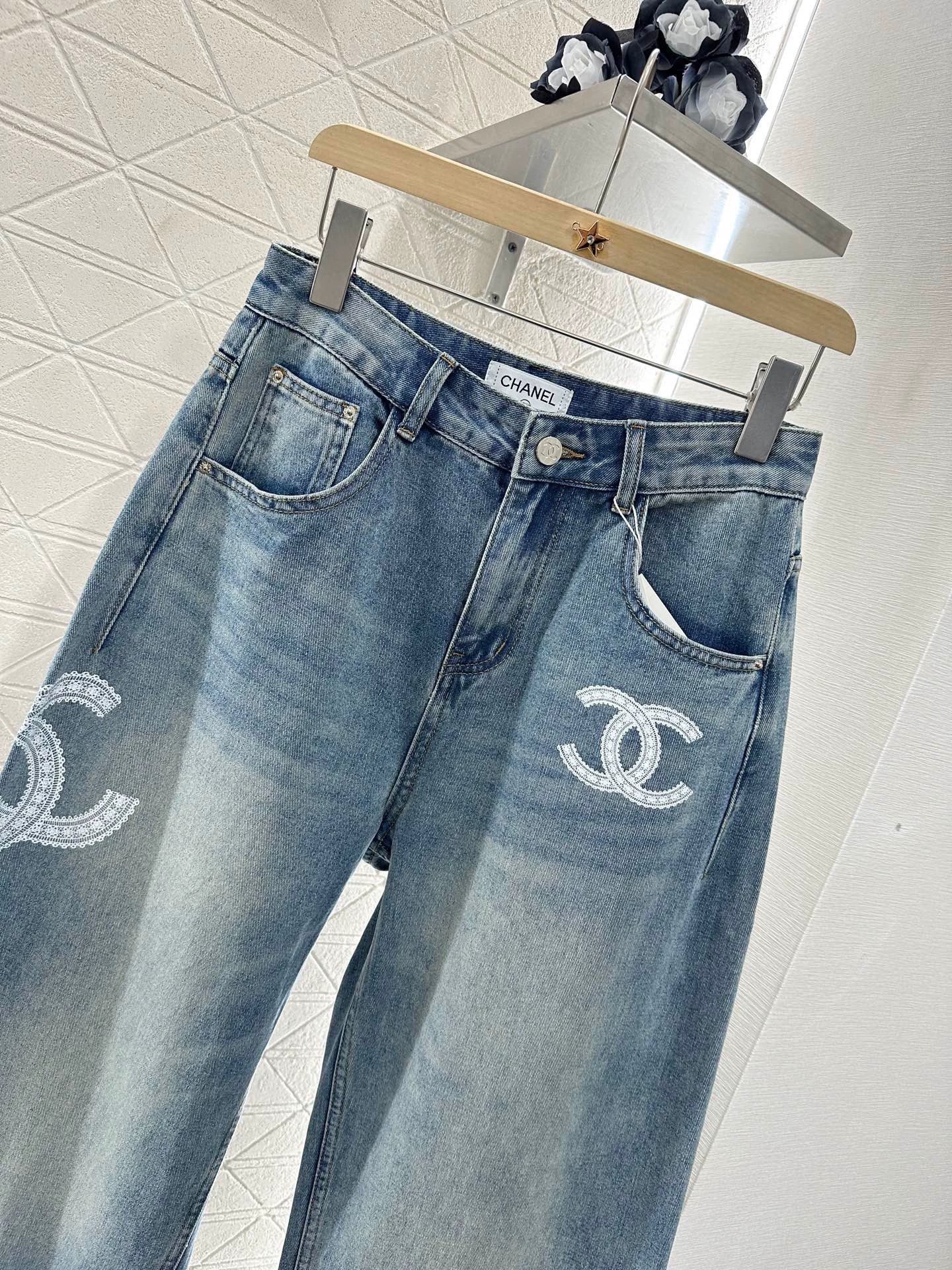 C 25 Lace-embroidered denim trousers