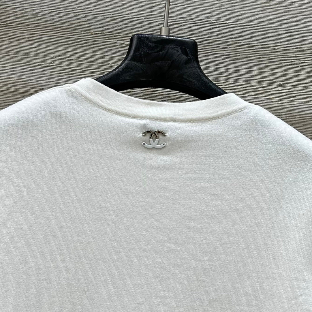 C 25 nouveaux produits, j'adore le haut à manches courtes en tricot double C