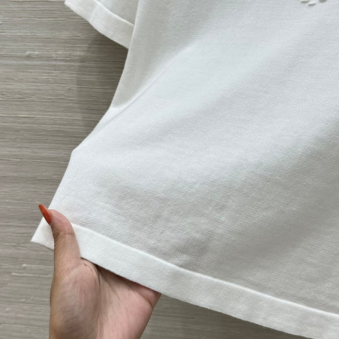 C 25 nouveaux produits, j'adore le haut à manches courtes en tricot double C