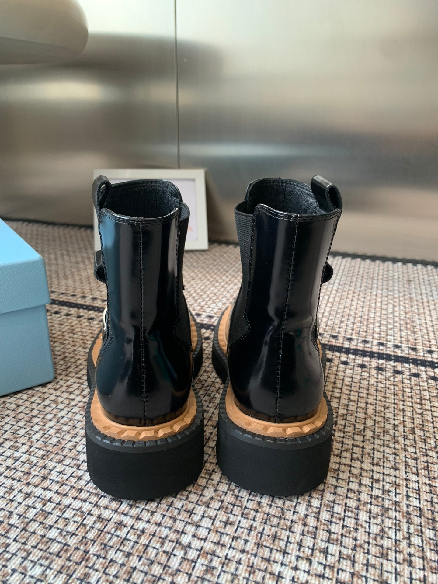 Pra 25fw Classic triangle ankle boots in shiny black