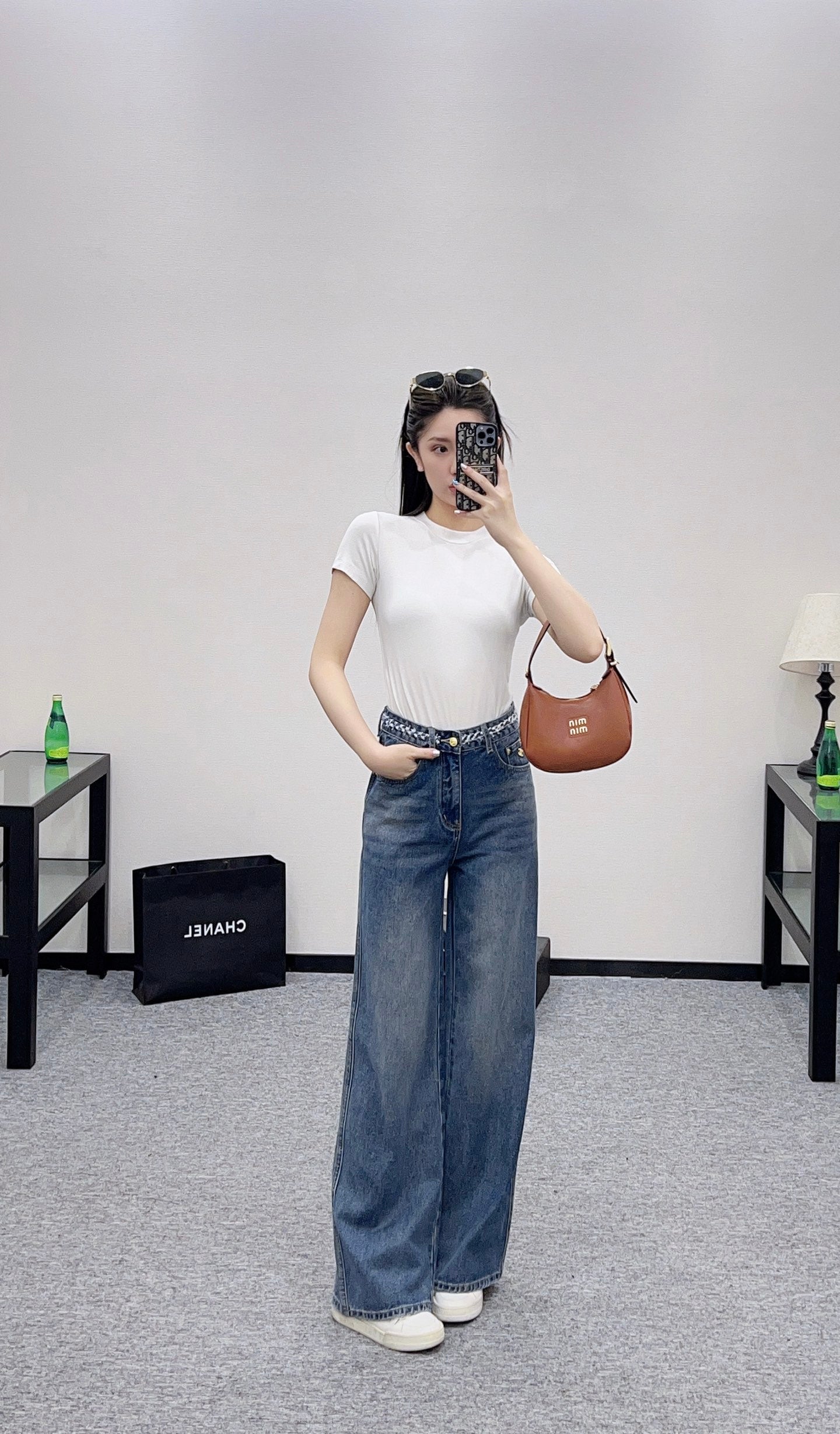 C 25 High-waisted bleached pleated denim trousers