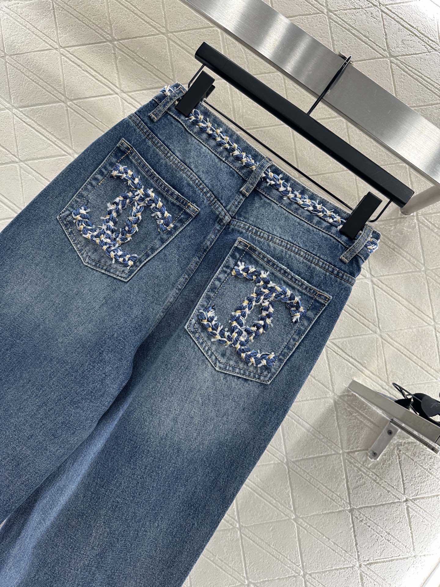 C 25 High-waisted bleached pleated denim trousers