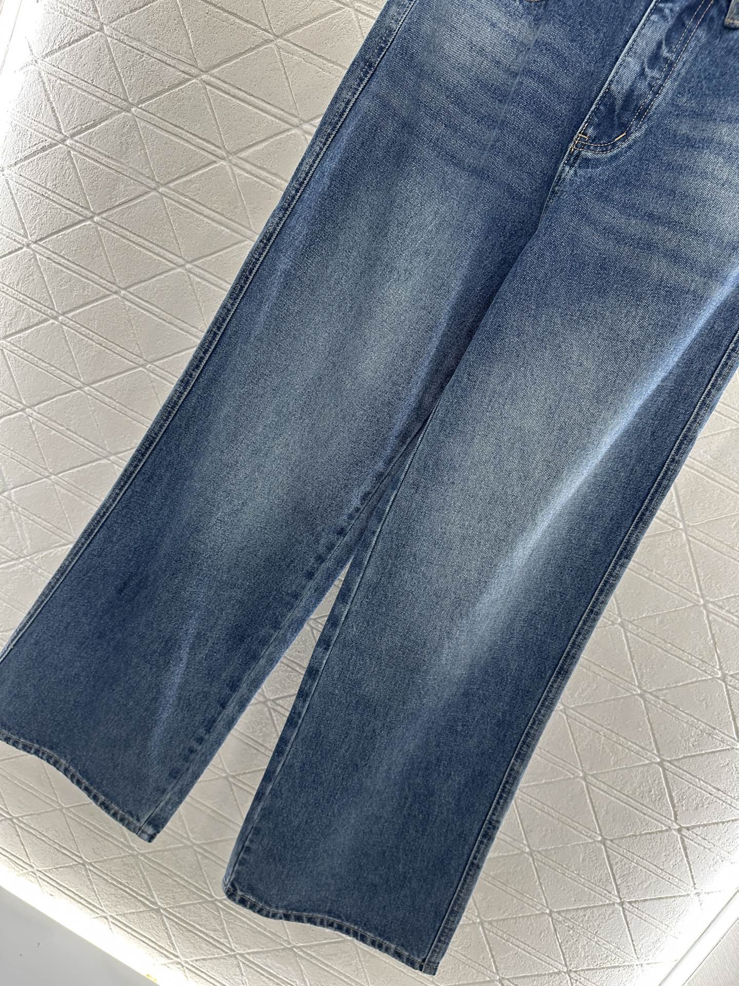 C 25 High-waisted bleached pleated denim trousers