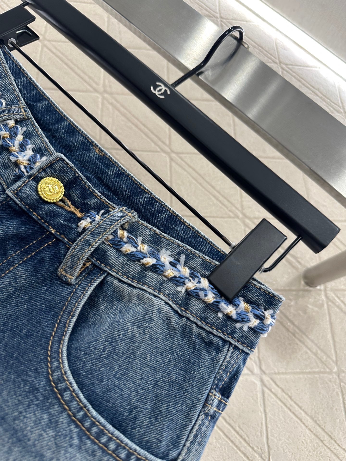 C 25 High-waisted bleached pleated denim trousers