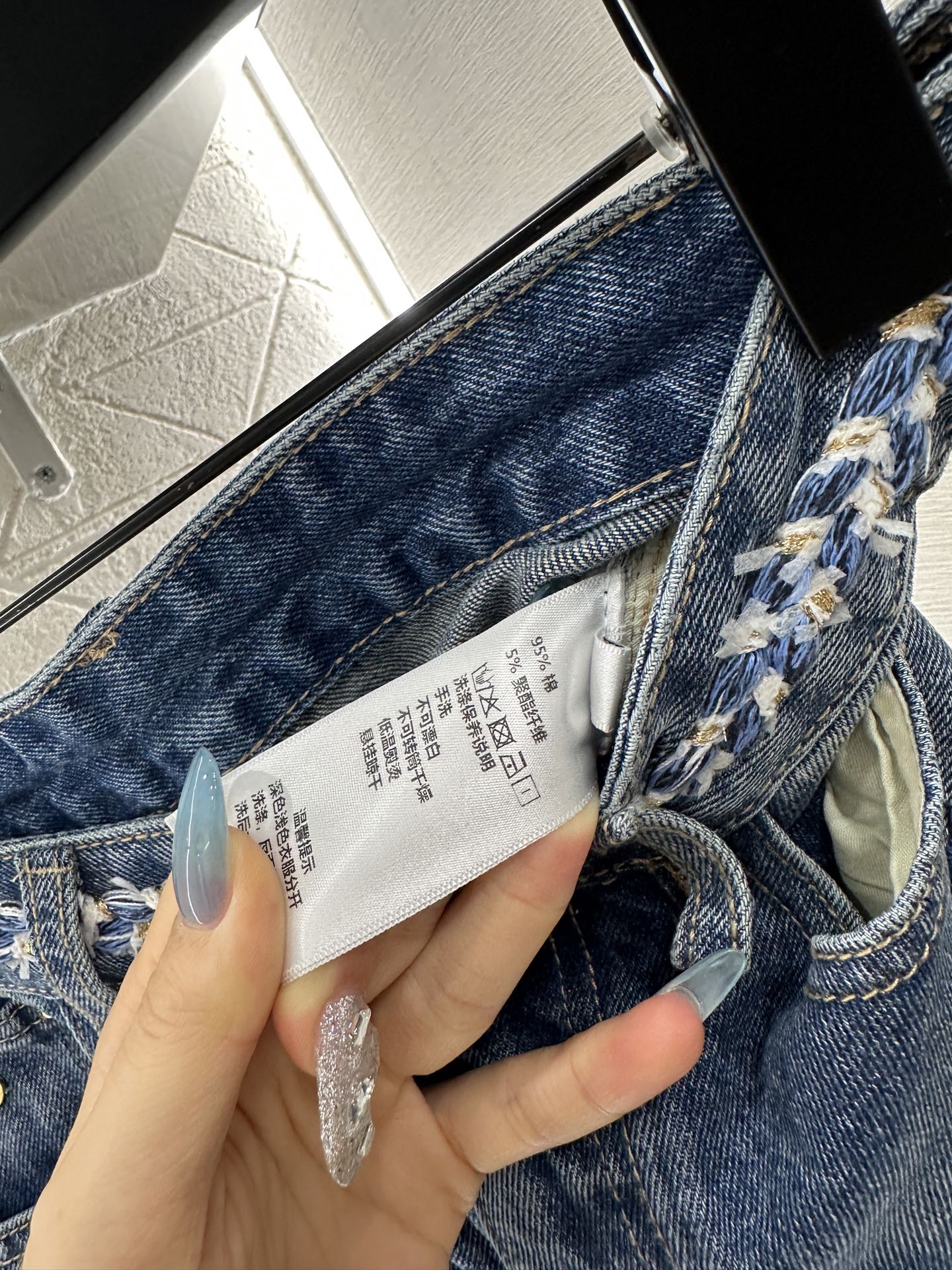 C 25 High-waisted bleached pleated denim trousers