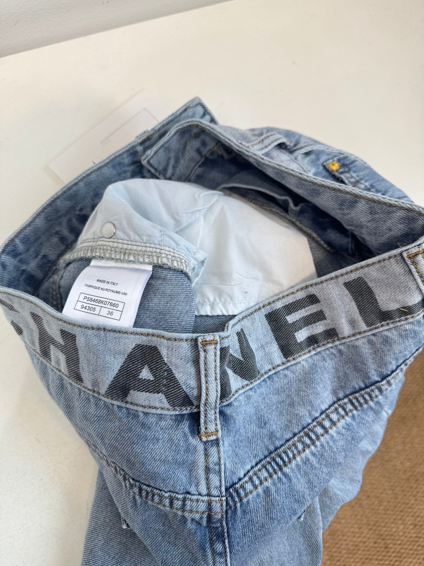 C 25 New distressed light wash jeans with logo letter design on waist