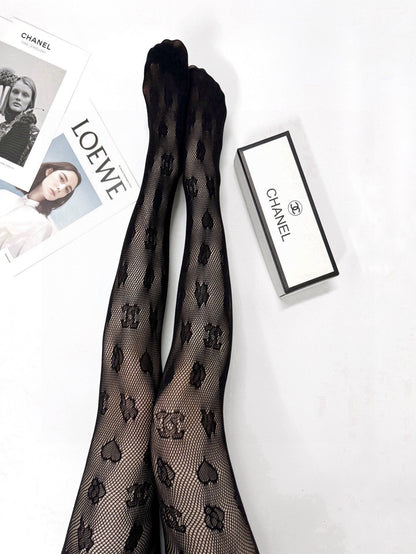 C Heart logo fishnet tights