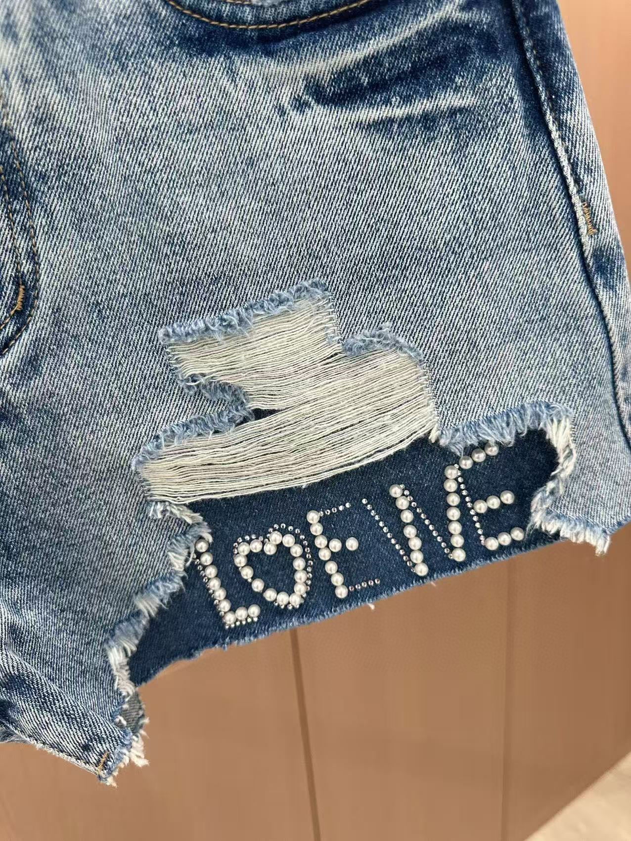 LO 25 Rhinestone Logo Ripped Denim Shorts