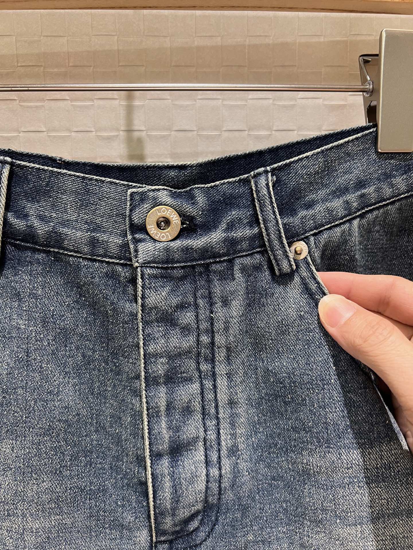 LO 25 Raw-edge fringe denim shorts