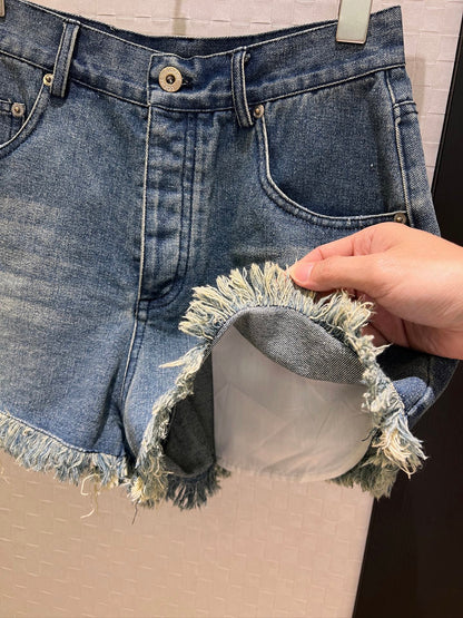 LO 25 Raw-edge fringe denim shorts