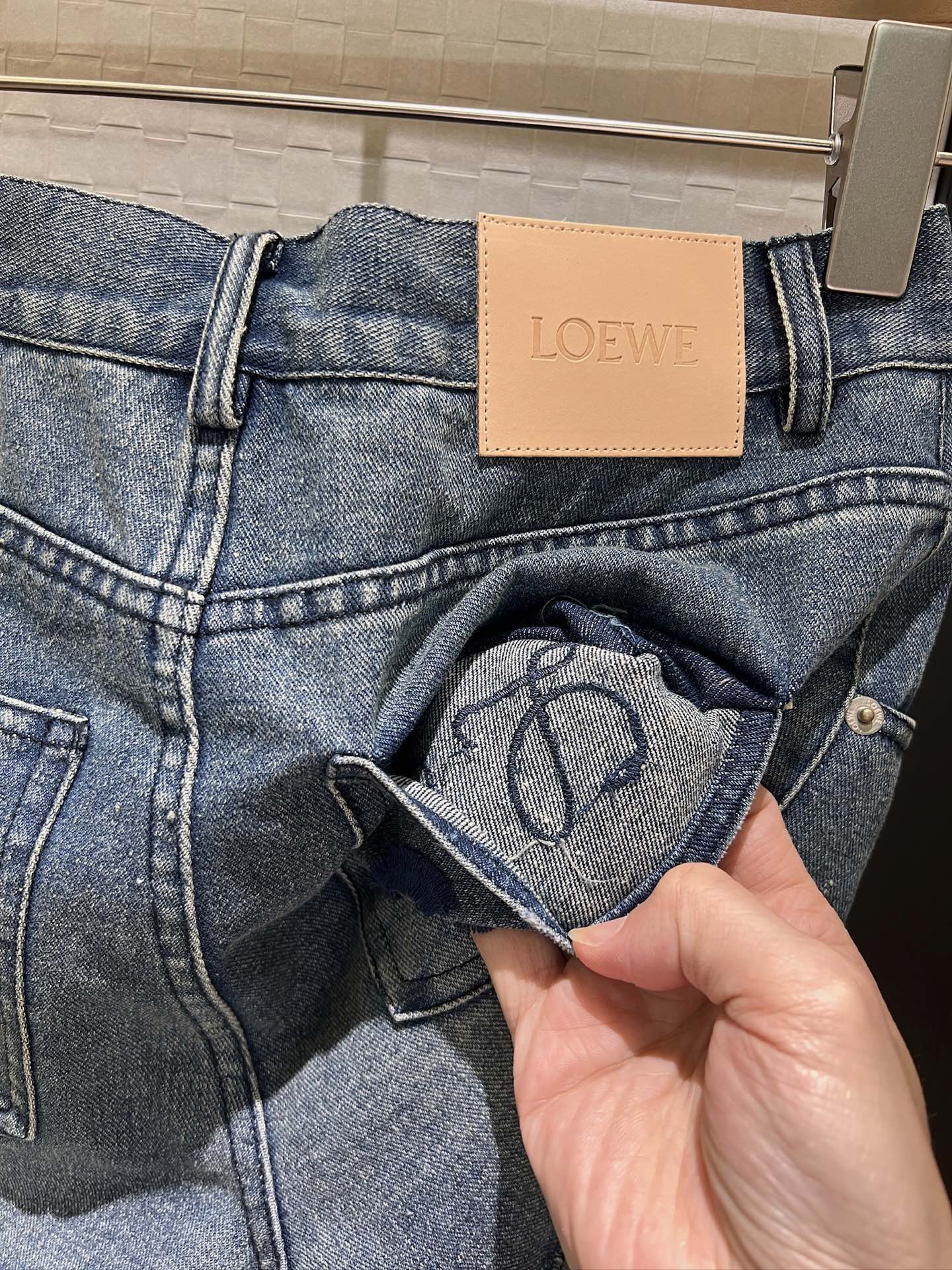 LO 25 Raw-edge fringe denim shorts
