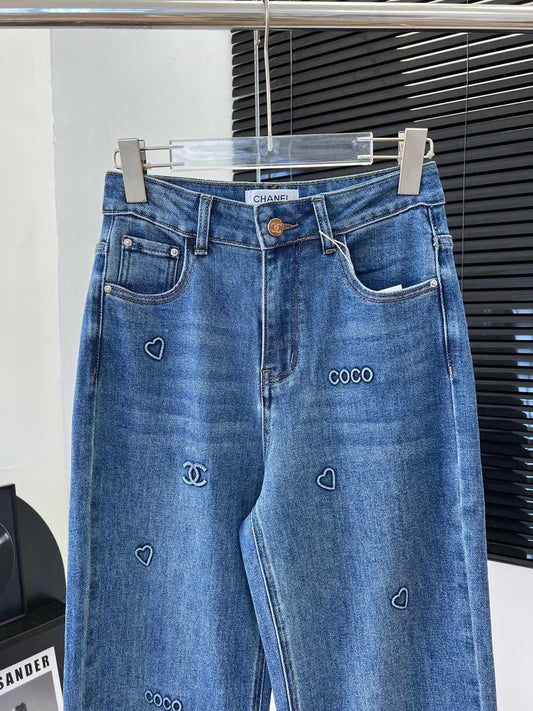 C 25 Laminated lettering stretch straight-leg trousers