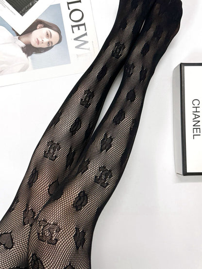 C Heart logo fishnet tights