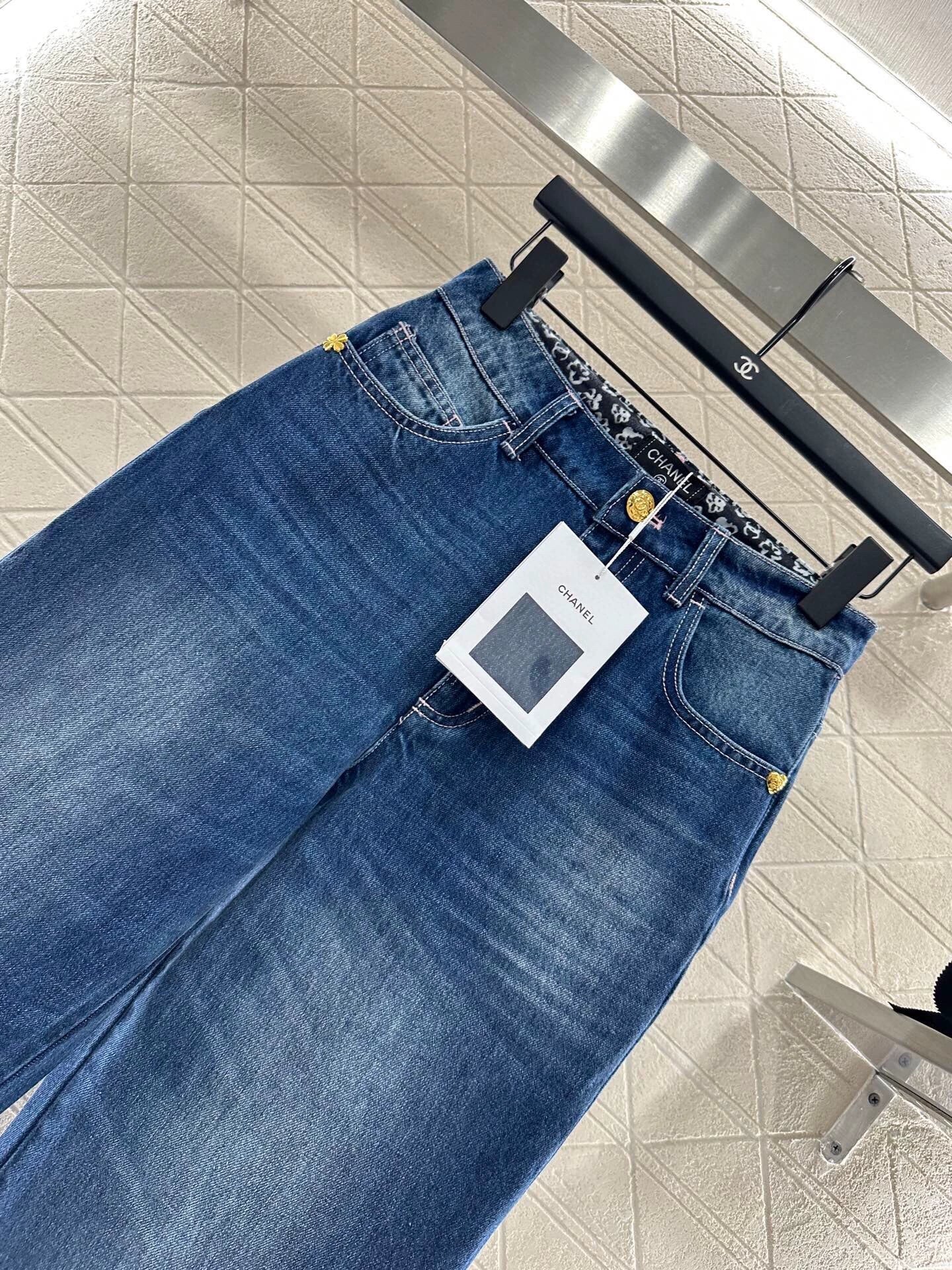 C 25 High-waisted bleached pleated denim trousers