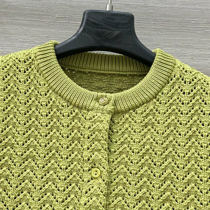 G 25 New Knitted cardigan with cut-out design.