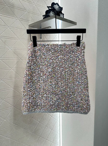 C 25 Knitted dress, vest, and skirt set.