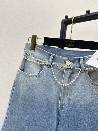 C 25 New early fall wide-leg jeans with a metal waist chain.