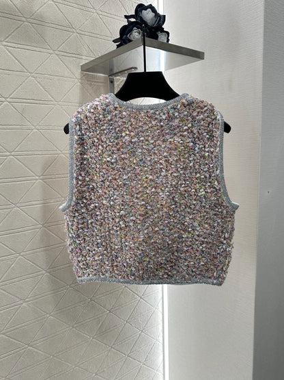 C 25 Knitted dress, vest, and skirt set.