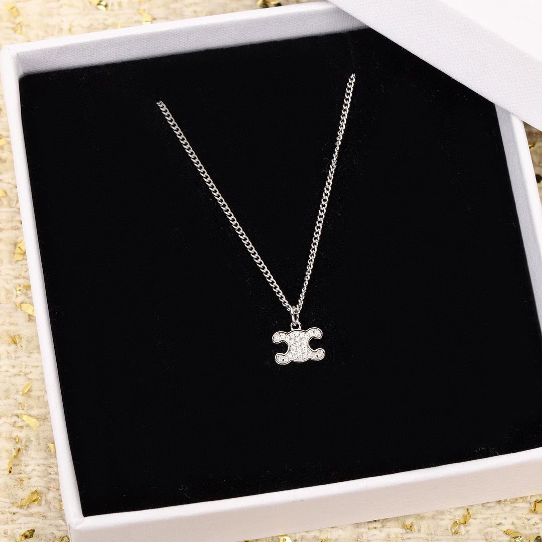 CE 25 Gold necklace with full diamond logo and Arc de Triomphe logo
