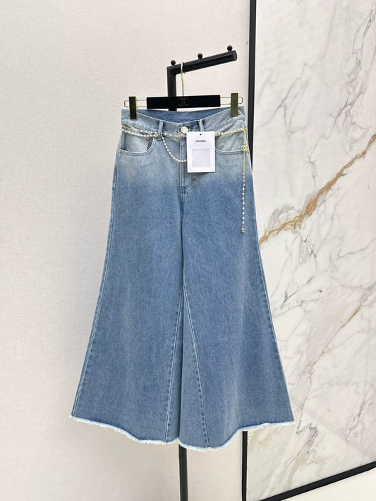 C 25 New early fall wide-leg jeans with a metal waist chain.