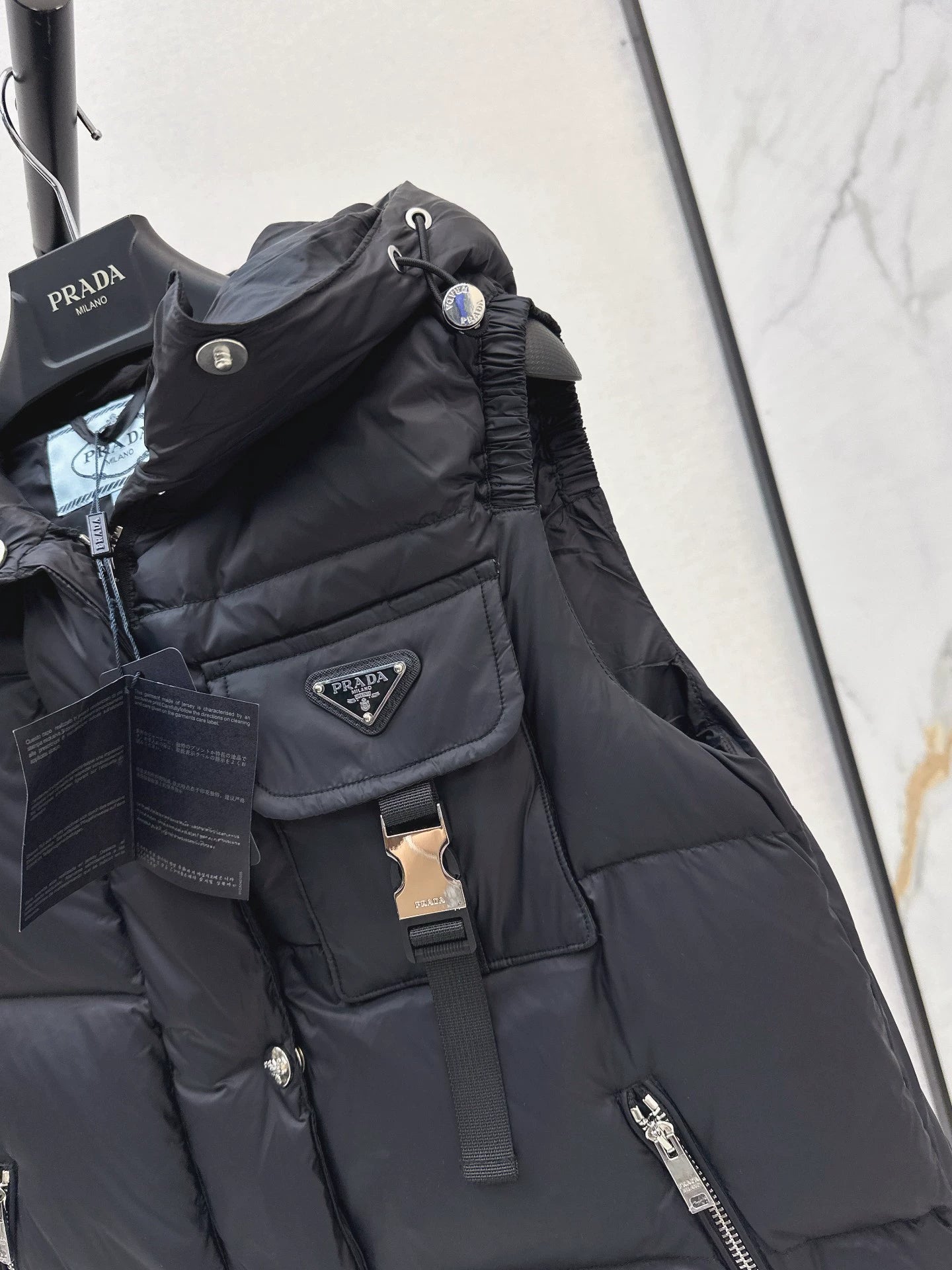 P 25fw hooded turtleneck down vest