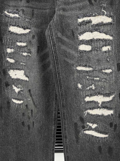 D 25 Ripped ink-splashed black and grey trousers Jeans