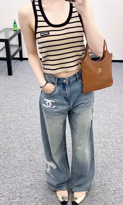 C 25 Lace-embroidered denim trousers