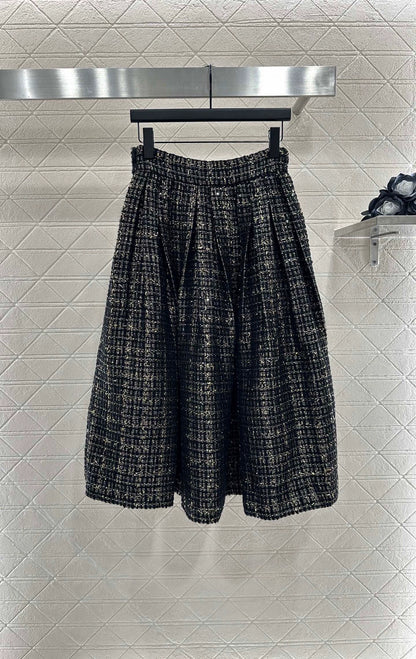 C 25 Round-neck dress and skirt set with beaded hem.