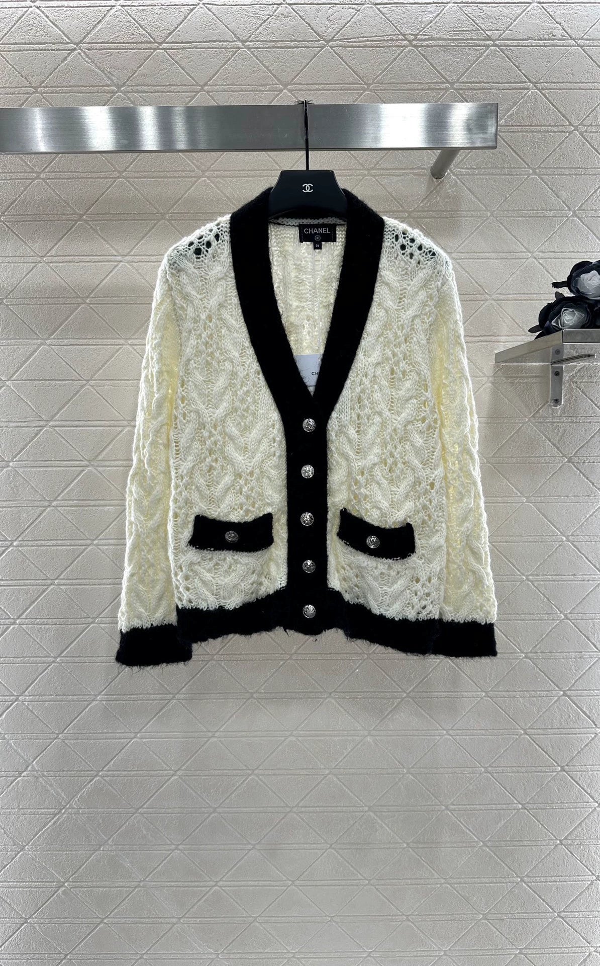C 25 Contrast-color crochet cardigan.